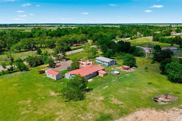 a view of a play house with a yard