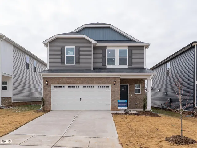 a view of a house with a garage