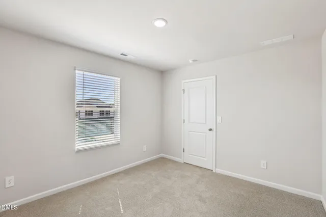 a view of storage and utility room with washer and dryer