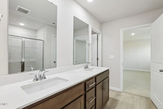 a bathroom with a bathtub and a sink
