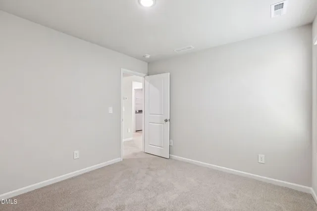 an outdoor view of a house with basket ball court
