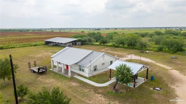 an aerial view of a house with a garden space