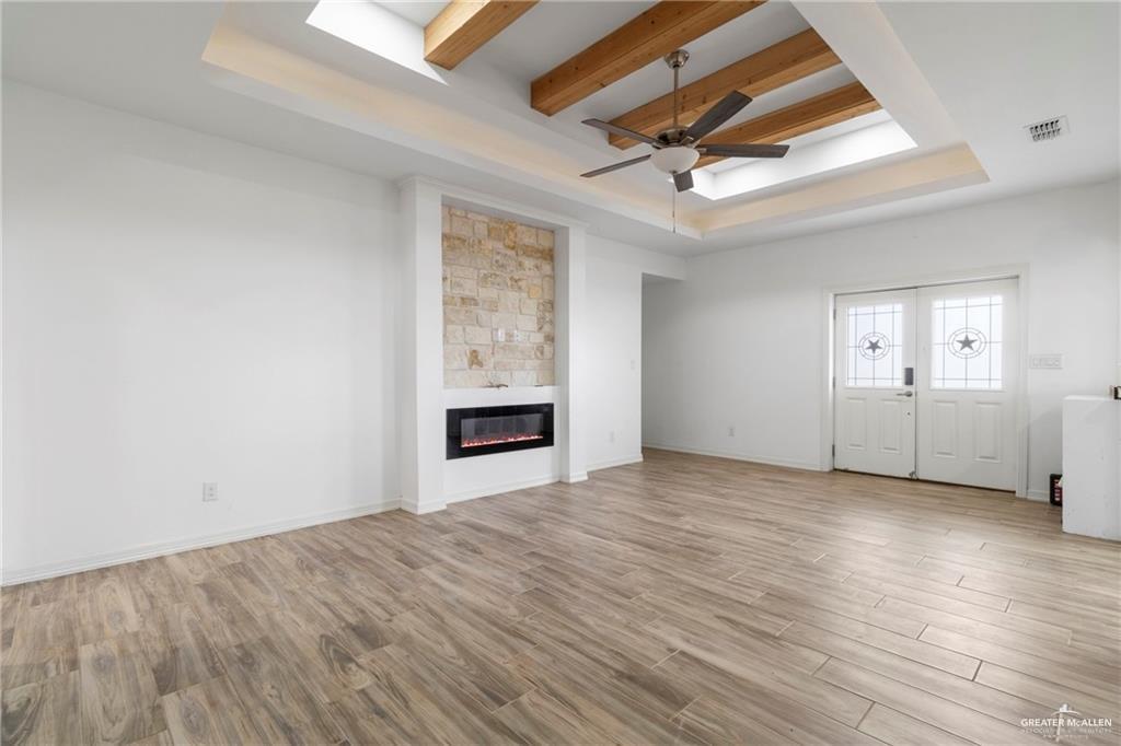 23208 Jesus Flores Road Edcouch, TX 78538 - Photo 6 of 13 an empty room with windows and ceiling fan