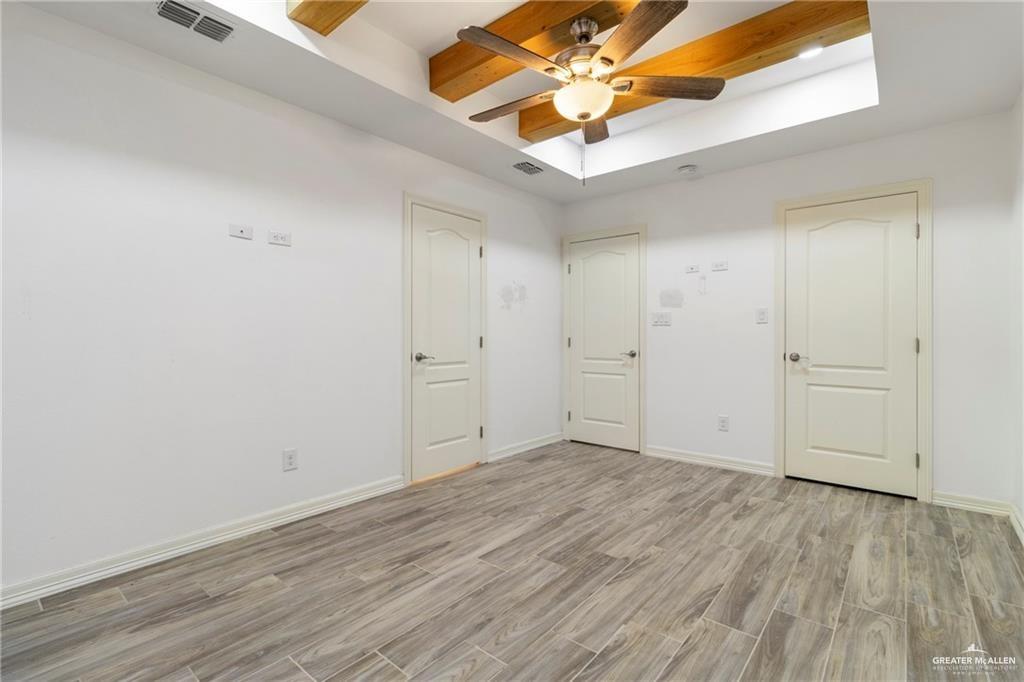 23208 Jesus Flores Road Edcouch, TX 78538 - Photo 9 of 13 wooden floor in an empty room