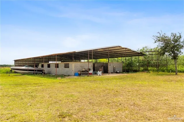 a view of a swimming pool with an outdoor seating and yard
