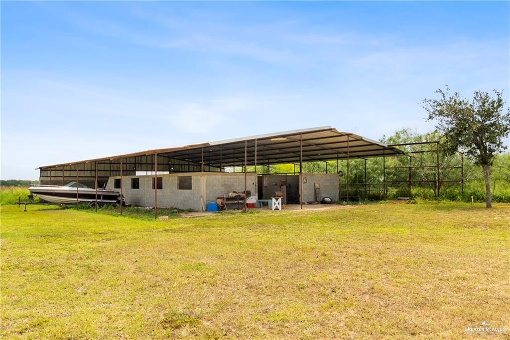 23208 Jesus Flores Road Edcouch, TX 78538 - Photo 10 of 13 a view of a swimming pool with an outdoor seating and yard