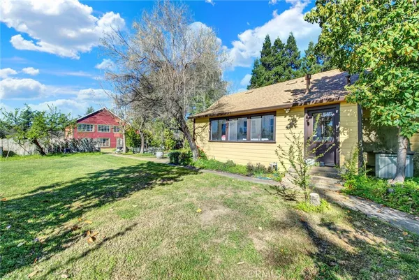 a house view with a garden space