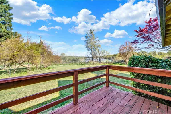 a view of outdoor space with wooden floor and outdoor seating
