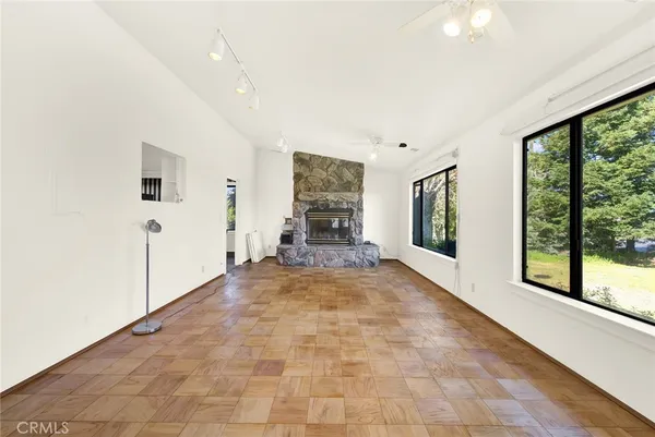 a view of a hallway with windows