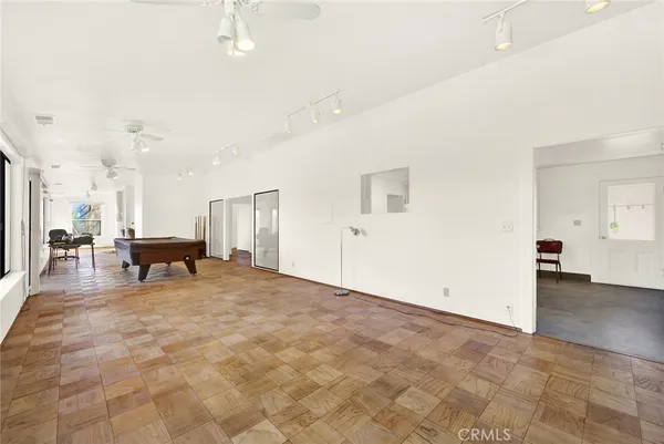 a view of a livingroom with furniture and an entryway