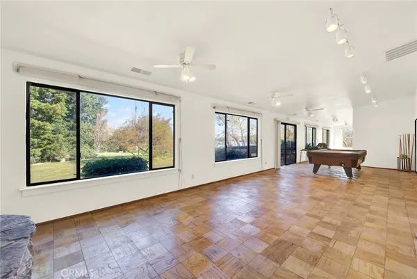 a view of livingroom with furniture wooden floor and windows