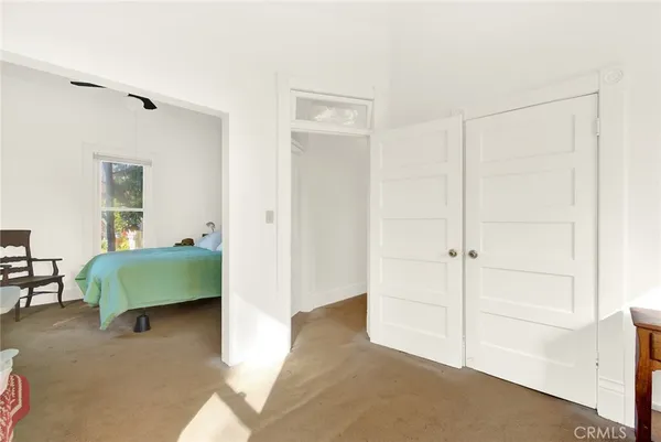 a view of room with window and hallway