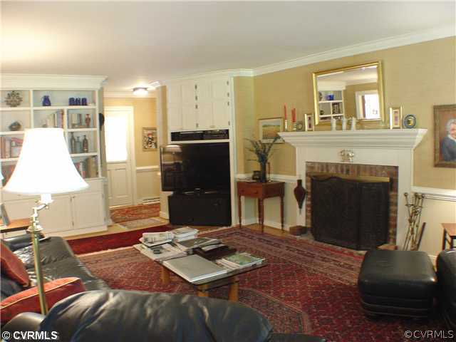 13901 Elmstead Road Midlothian, VA 23113 - Photo 4 of 12 a living room with furniture and a fireplace