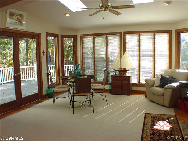 13901 Elmstead Road Midlothian, VA 23113 - Photo 6 of 12 a living room with furniture and a floor to ceiling window