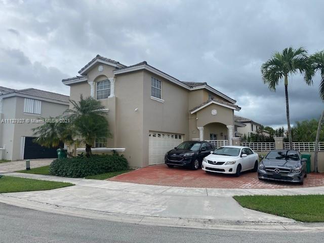 9475 Southwest 154th Court Miami, FL 33196 - Photo 1 of 27 a car parked in front of house