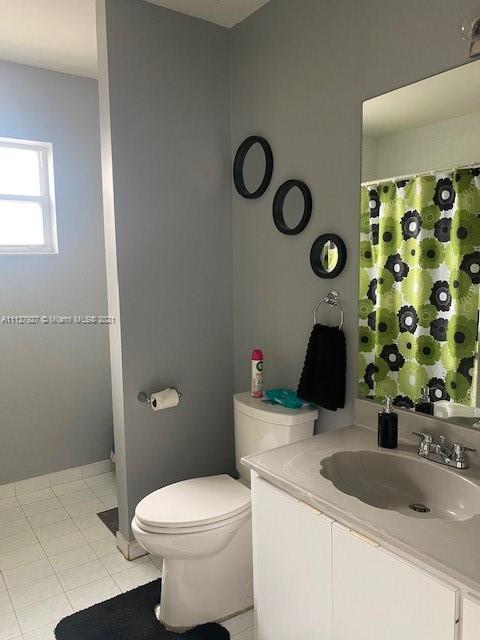 9475 Southwest 154th Court Miami, FL 33196 - Photo 11 of 27 a bathroom with a sink and a toilet
