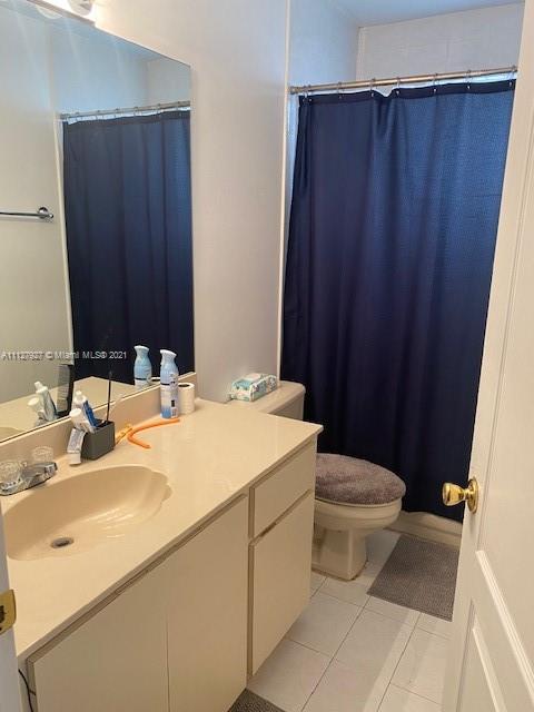 9475 Southwest 154th Court Miami, FL 33196 - Photo 13 of 27 a bathroom with a sink and a toilet
