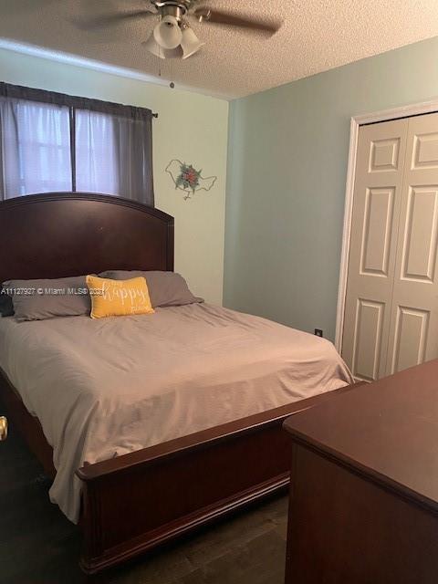 9475 Southwest 154th Court Miami, FL 33196 - Photo 14 of 27 a bedroom with a bed and window
