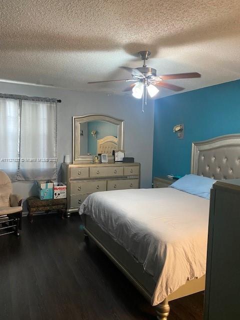 9475 Southwest 154th Court Miami, FL 33196 - Photo 15 of 27 a bedroom with a bed and a chandelier