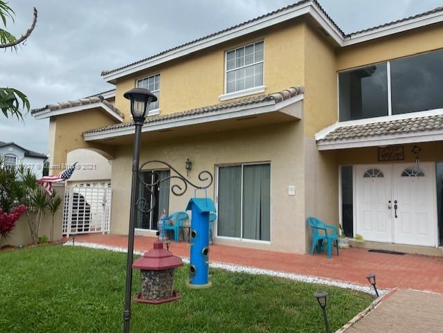9475 Southwest 154th Court Miami, FL 33196 - Photo 24 of 27 a front view of a house with garden