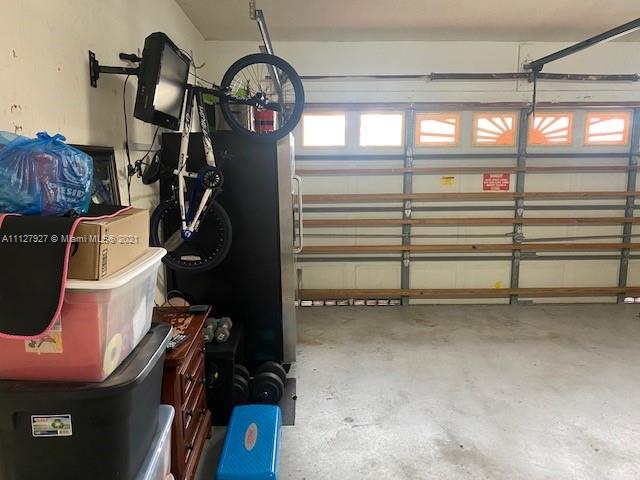 9475 Southwest 154th Court Miami, FL 33196 - Photo 26 of 27 a view of a room with gym equipment