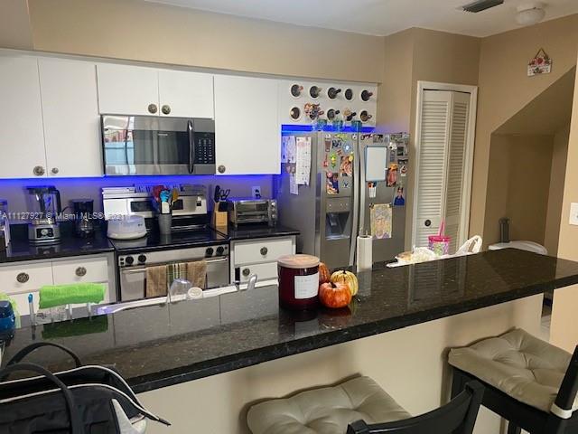 9475 Southwest 154th Court Miami, FL 33196 - Photo 4 of 27 a room with stainless steel appliances furniture and a kitchen view