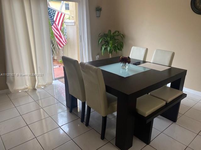 9475 Southwest 154th Court Miami, FL 33196 - Photo 5 of 27 a view of a dining room with furniture and wooden floor