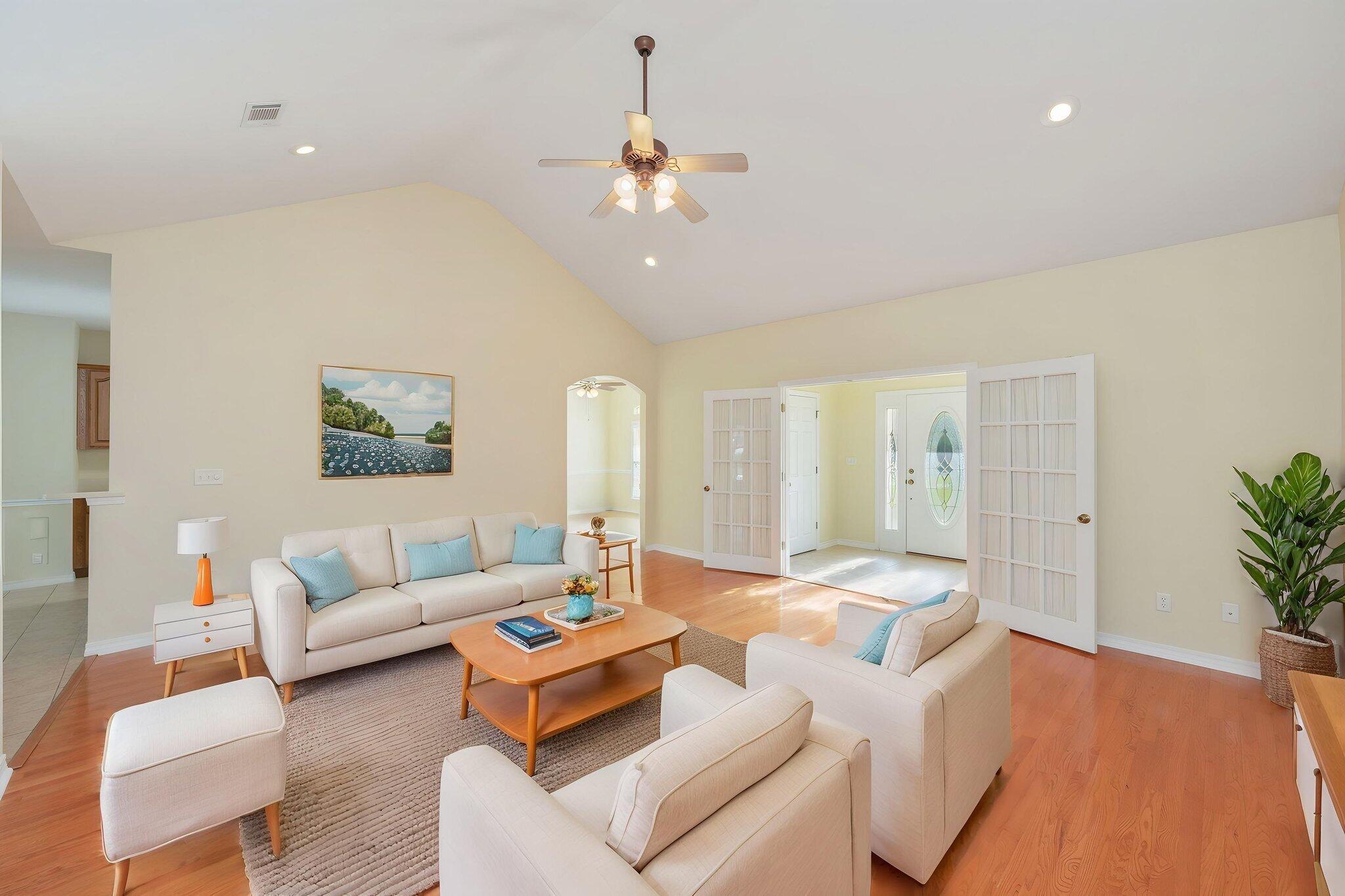 5552 Frontier Drive Crestview, FL 32536 - Photo 10 of 50 a living room with furniture and a chandelier