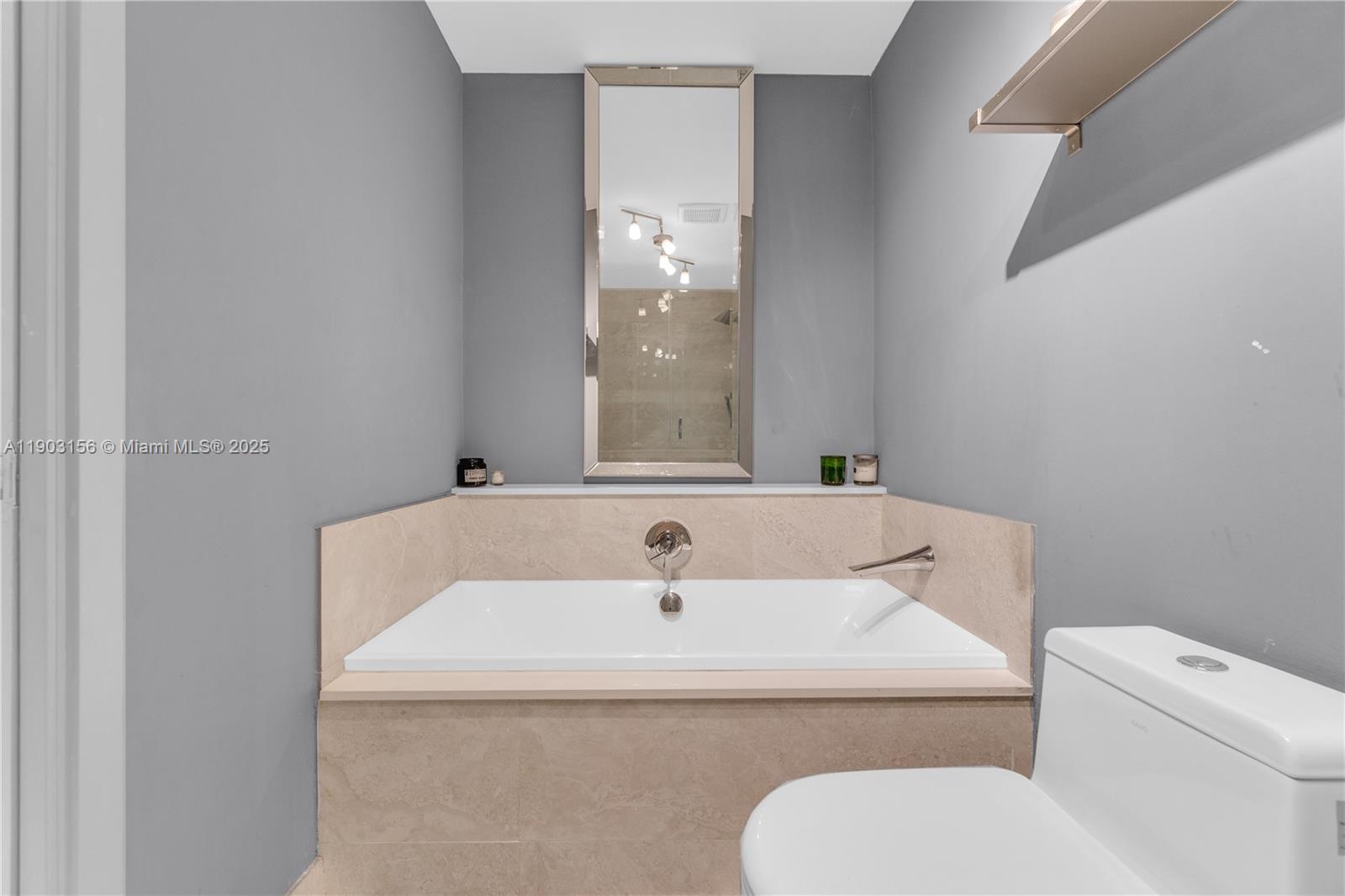 488 Northeast 18th Street, Unit 2104 Miami, FL 33132 - Photo 16 of 44 a bathroom with a sink and a toilet