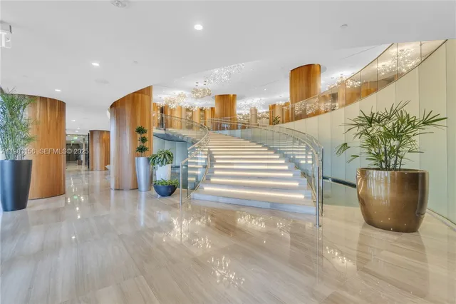 a view of a living room and entry way