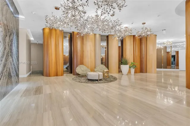 a view of a livingroom with furniture and an entryway