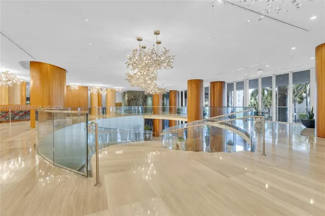 a view of a living room and chandelier