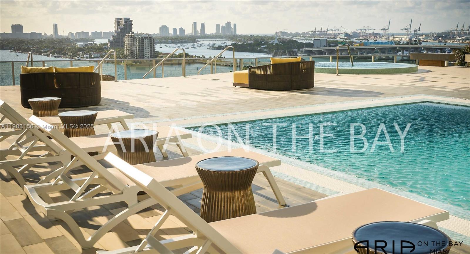 488 Northeast 18th Street, Unit 2104 Miami, FL 33132 - Photo 43 of 44 a view of a swimming pool with a lounge chairs