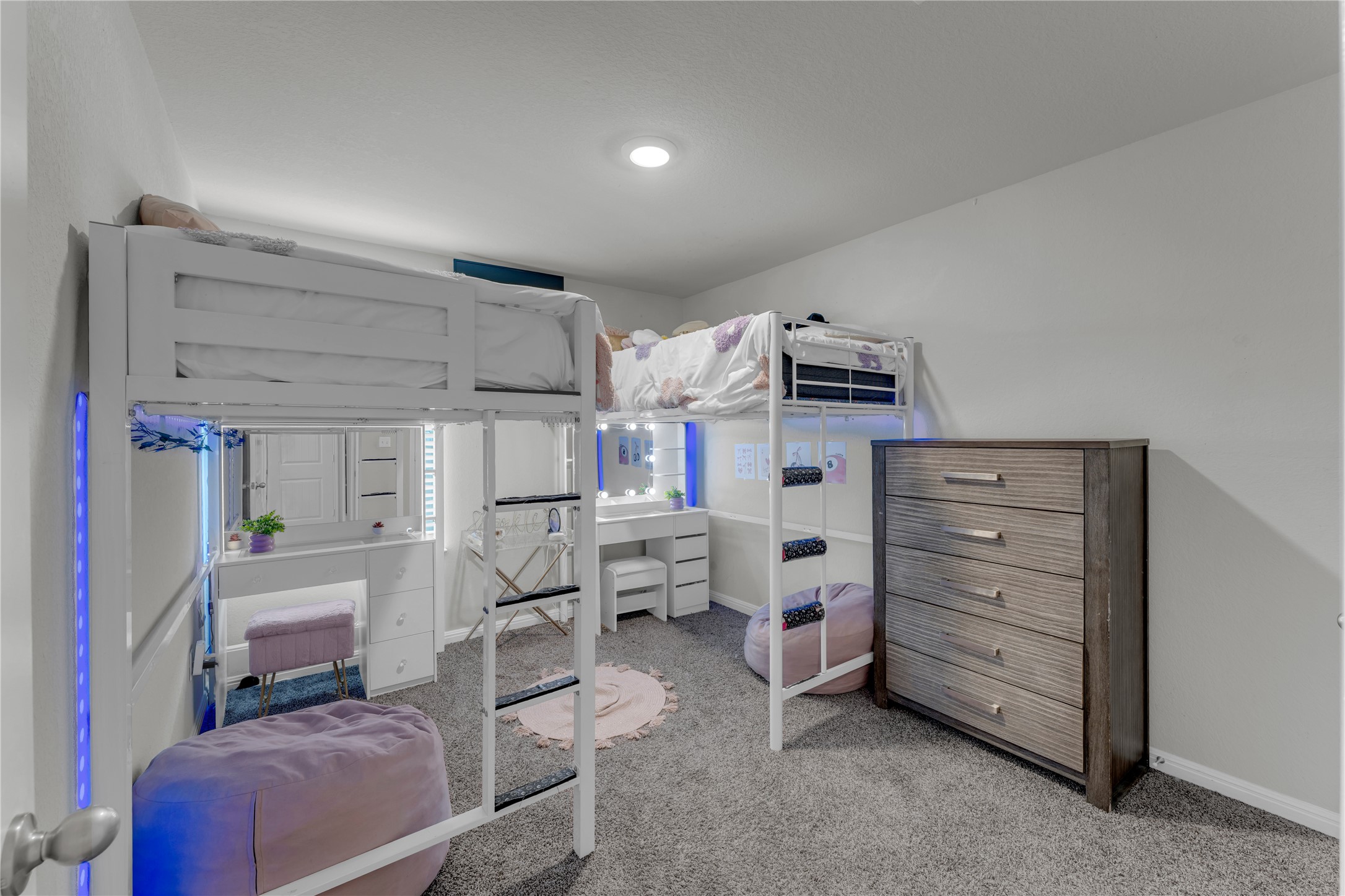 132 Cinnamon Loop Burnet, TX 78611 - Photo 17 of 27 Room featuring two integrated loft beds with ladders, recessed ceiling lighting, and gray carpet flooring