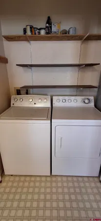 a utility room with washer and dryer