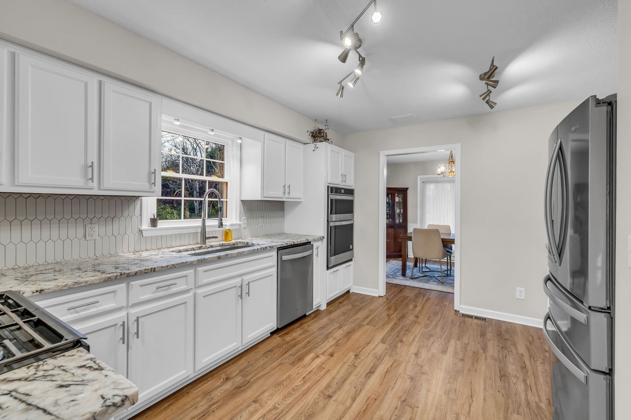 260 Pleasant Run Road Smyrna, TN 37167 - Photo 12 of 35 a kitchen with stainless steel appliances a refrigerator sink and cabinets