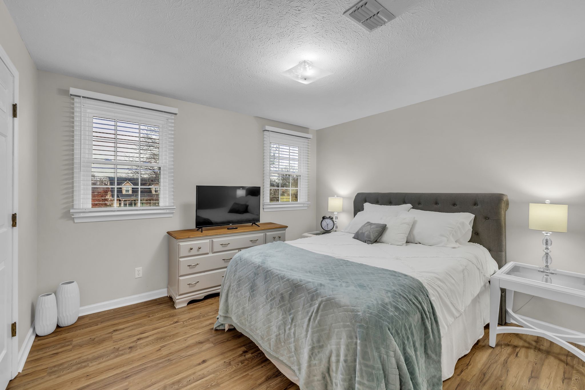 260 Pleasant Run Road Smyrna, TN 37167 - Photo 23 of 35 a bedroom with a bed and a flat screen tv