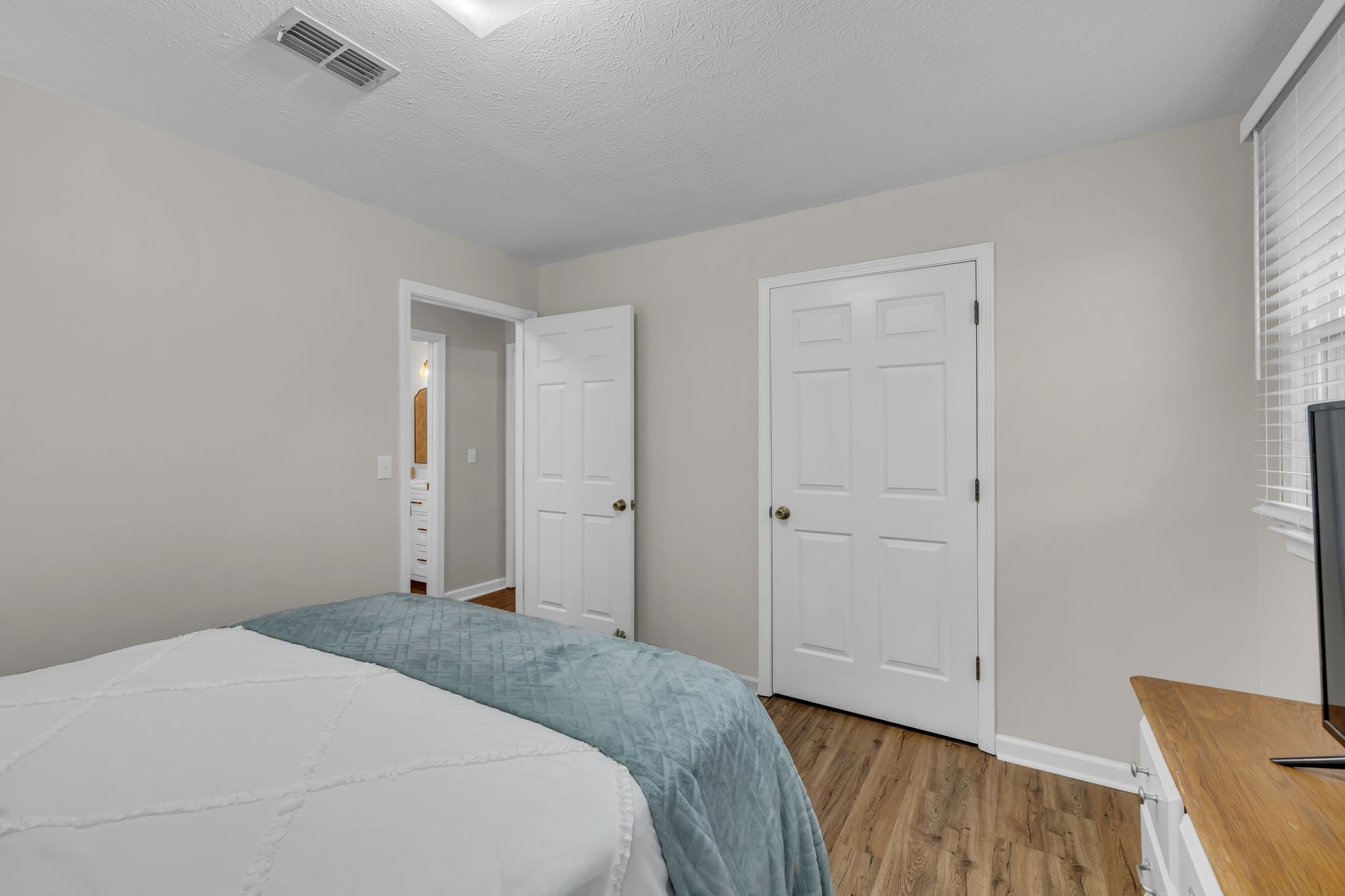 260 Pleasant Run Road Smyrna, TN 37167 - Photo 24 of 35 a bedroom with a bed and wooden floor