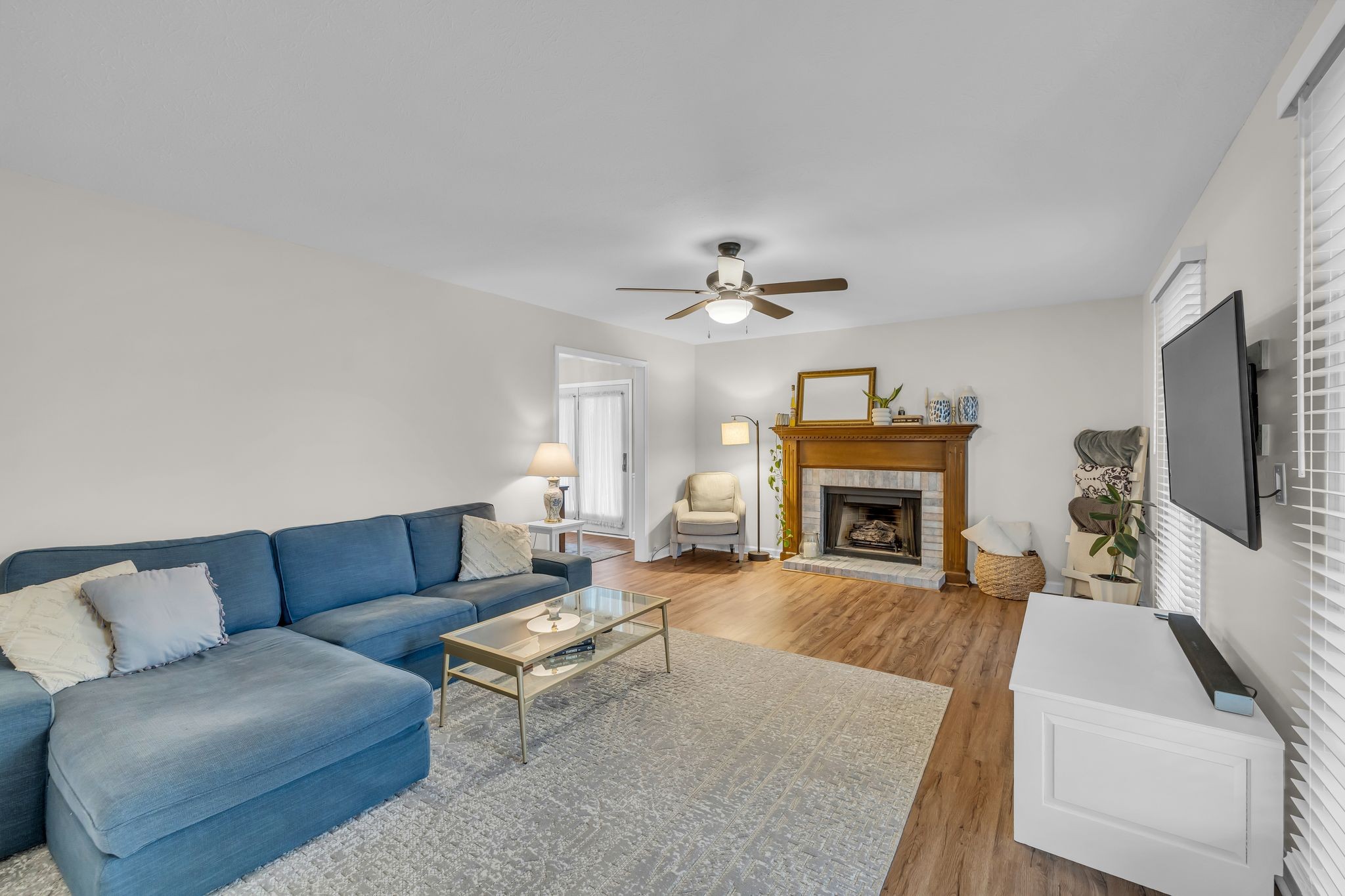 260 Pleasant Run Road Smyrna, TN 37167 - Photo 4 of 35 a living room with furniture a fireplace and a flat screen tv
