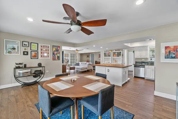 a view of a dining room with furniture and wooden floor