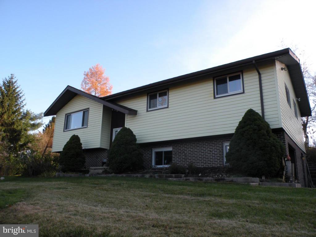 236 Zartman Mill Road Lititz, PA 17543 - Photo 1 of 22 a house view with a garden space