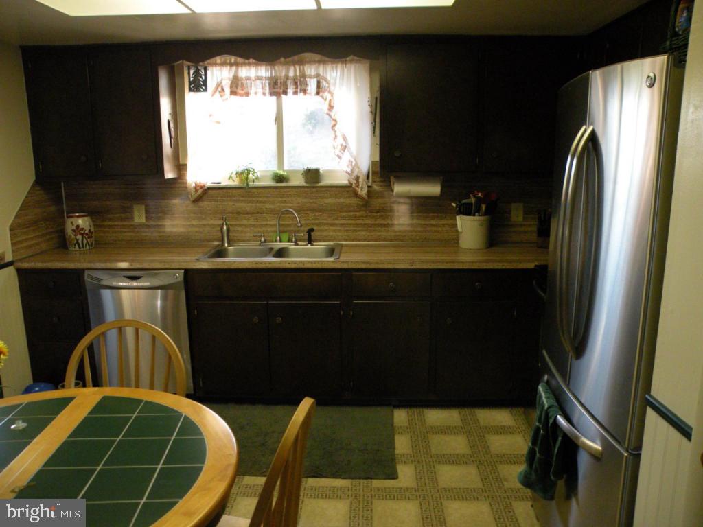 236 Zartman Mill Road Lititz, PA 17543 - Photo 11 of 22 a kitchen with stainless steel appliances a sink stove and refrigerator