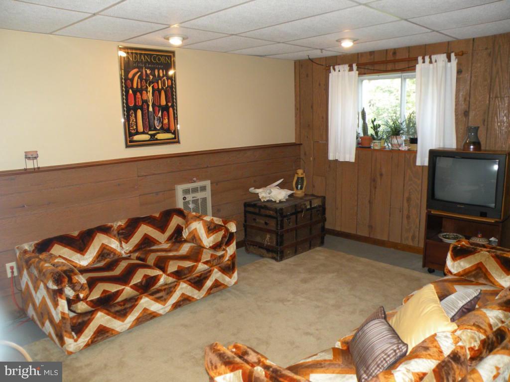 236 Zartman Mill Road Lititz, PA 17543 - Photo 17 of 22 a bedroom with furniture and a flat screen tv