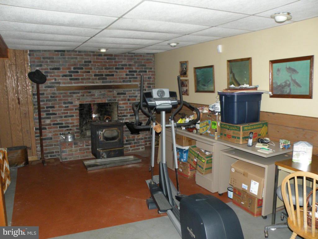 236 Zartman Mill Road Lititz, PA 17543 - Photo 18 of 22 a living room with furniture a flat screen tv and a fireplace