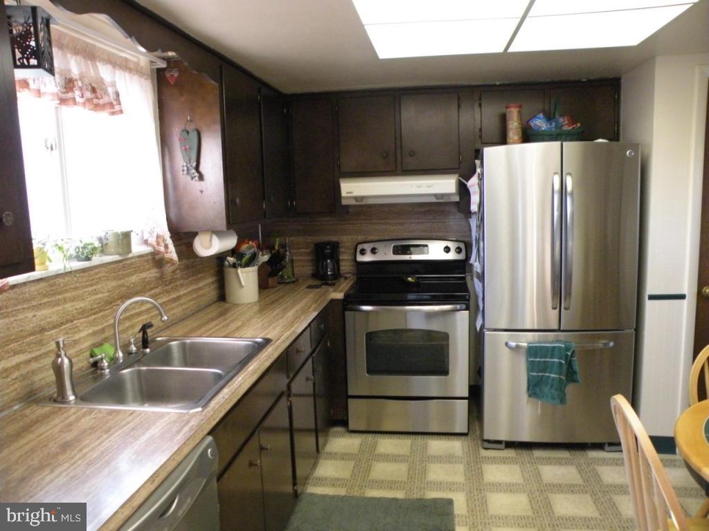 236 Zartman Mill Road Lititz, PA 17543 - Photo 9 of 22 a kitchen with a refrigerator sink and stove