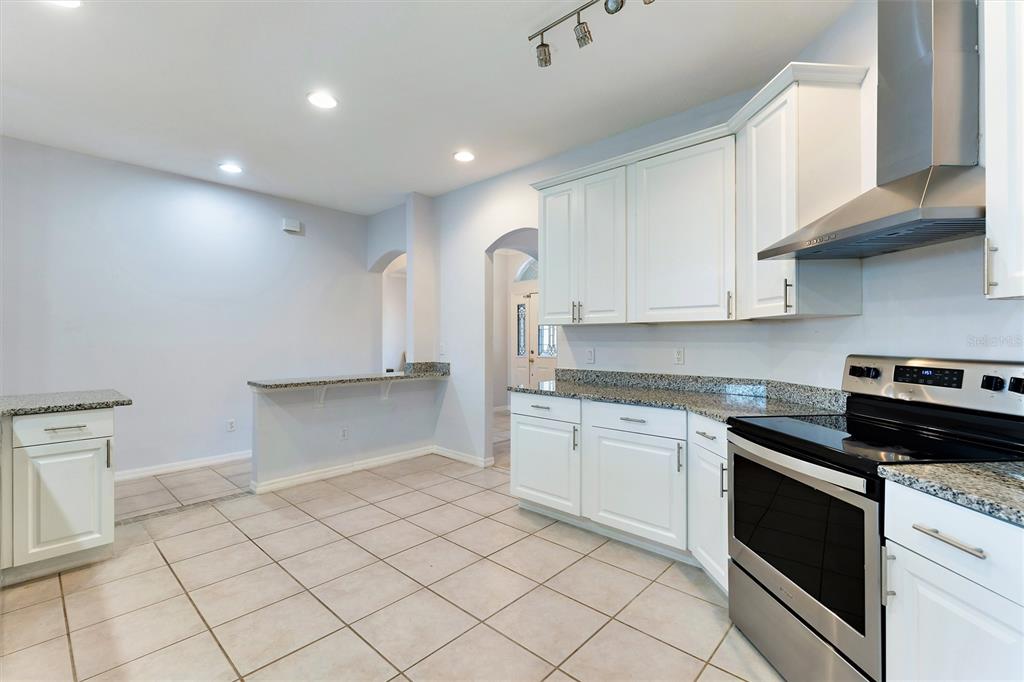 3984 Beacon Ridge Way Clermont, FL 34711 - Photo 15 of 59 Kitchen with view of Hallway & Dining Room Entry