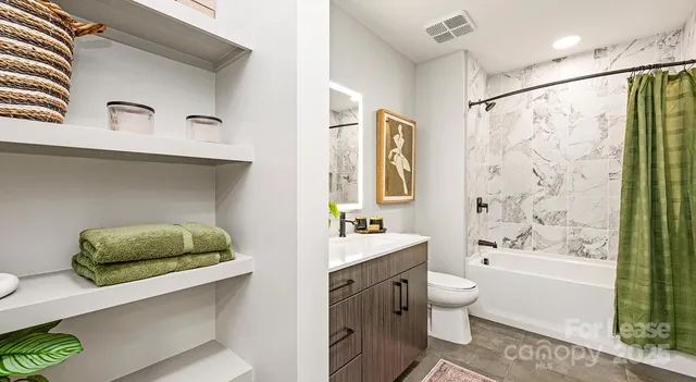 a bathroom with a sink double vanity and a tub