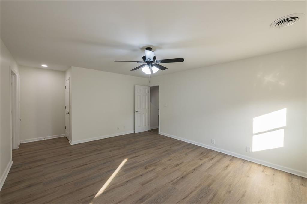 5081 Hubert Drive Powder Springs, GA 30127 - Photo 19 of 32 wooden floor in an empty room with a window