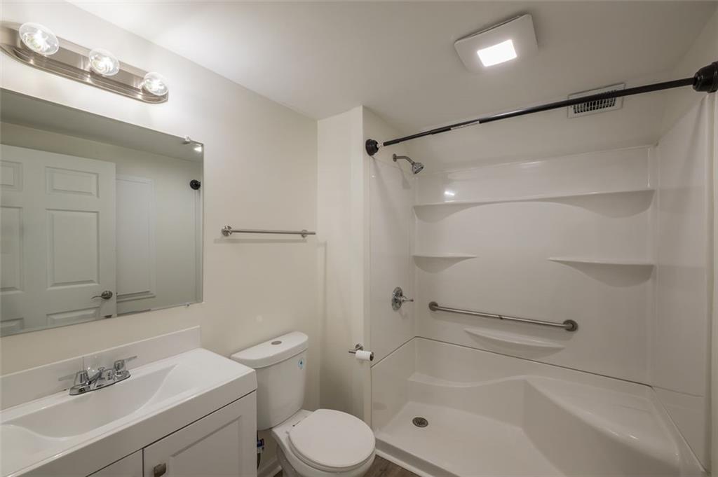 5081 Hubert Drive Powder Springs, GA 30127 - Photo 21 of 32 a bathroom with a sink a toilet and shower