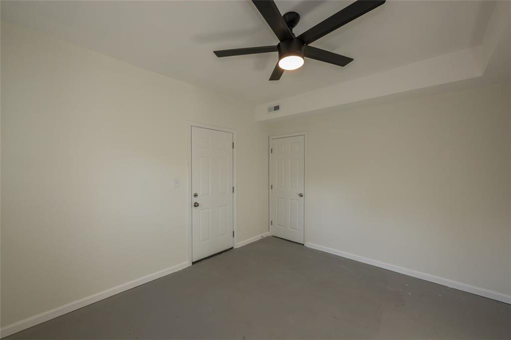 5081 Hubert Drive Powder Springs, GA 30127 - Photo 22 of 32 an empty room with a fan and a fan